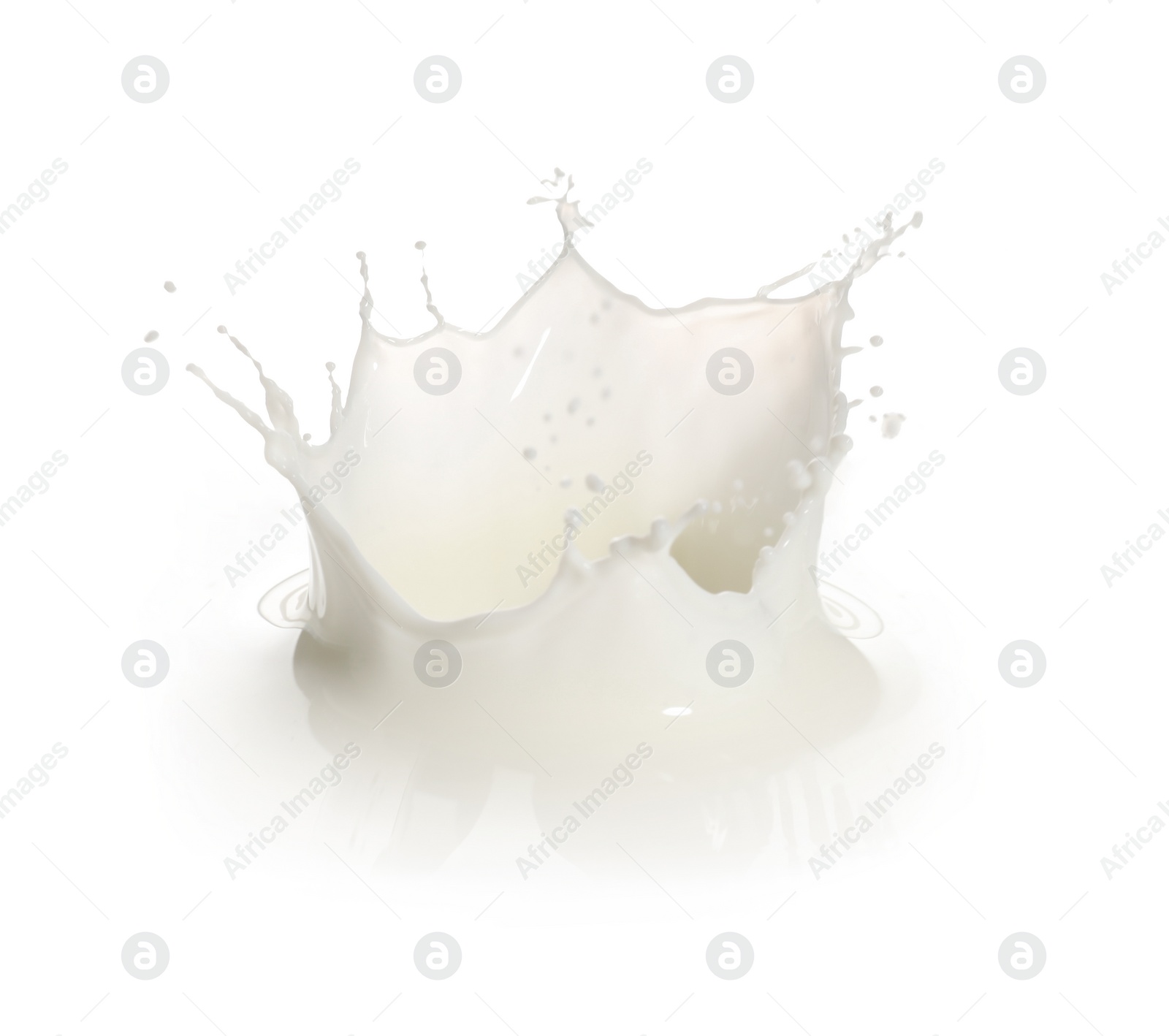 Photo of Splash of fresh milk on white background