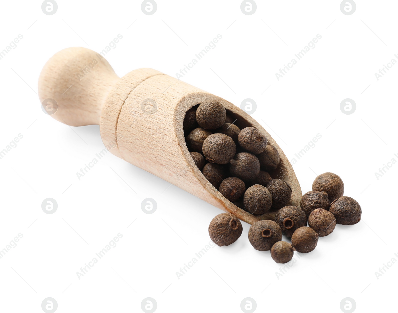 Photo of Dry allspice berries (Jamaica pepper) in scoop isolated on white
