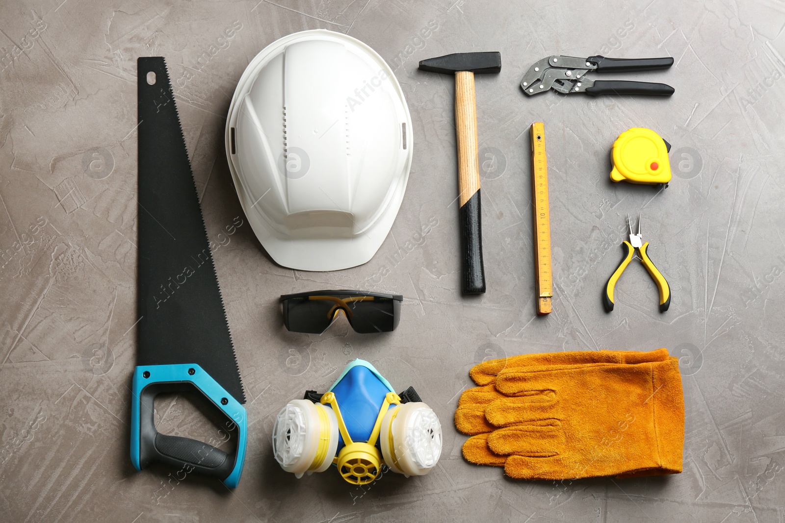 Photo of Flat lay composition with different construction tools on color background