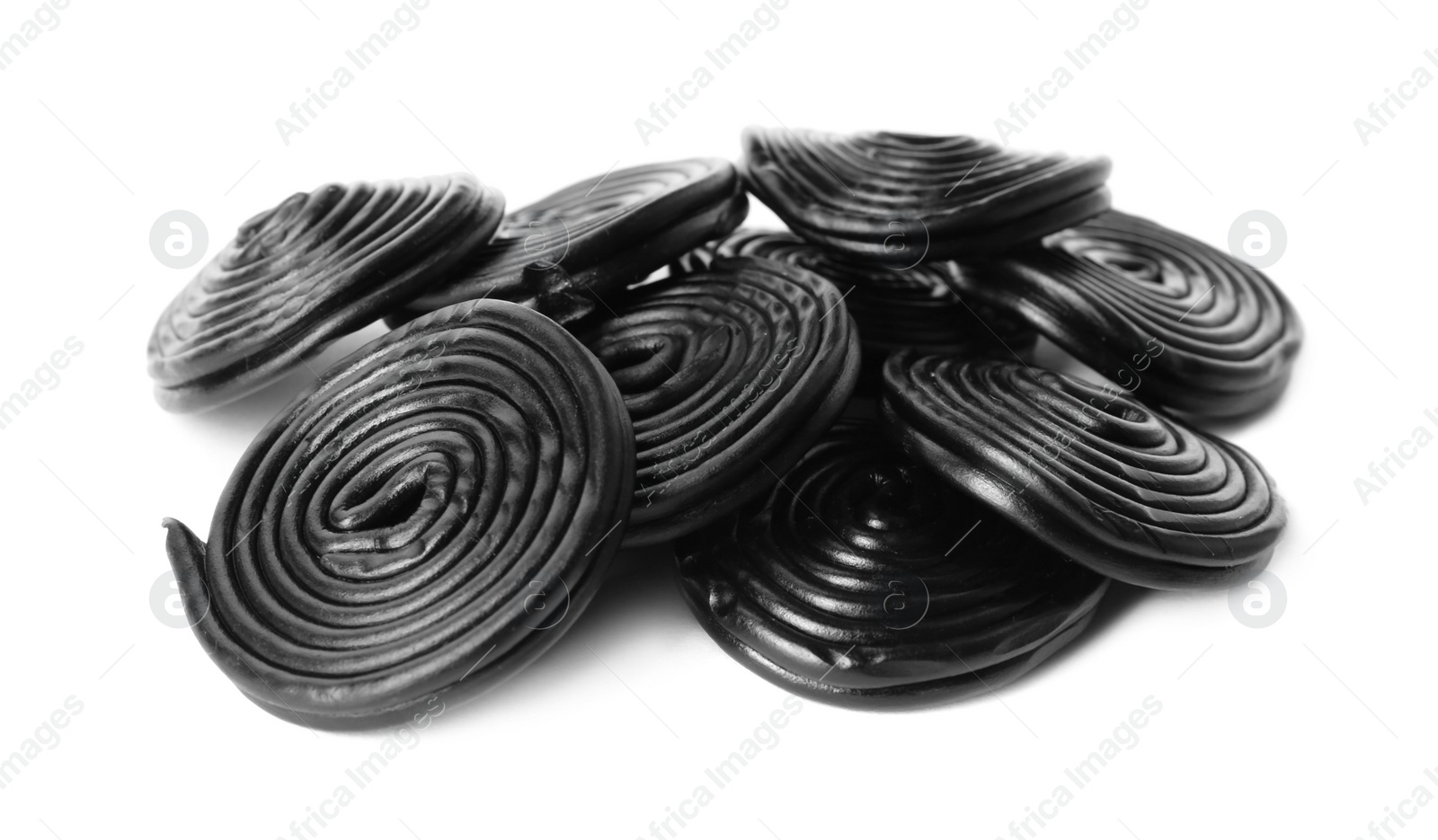 Photo of Tasty black liquorice candies on white background