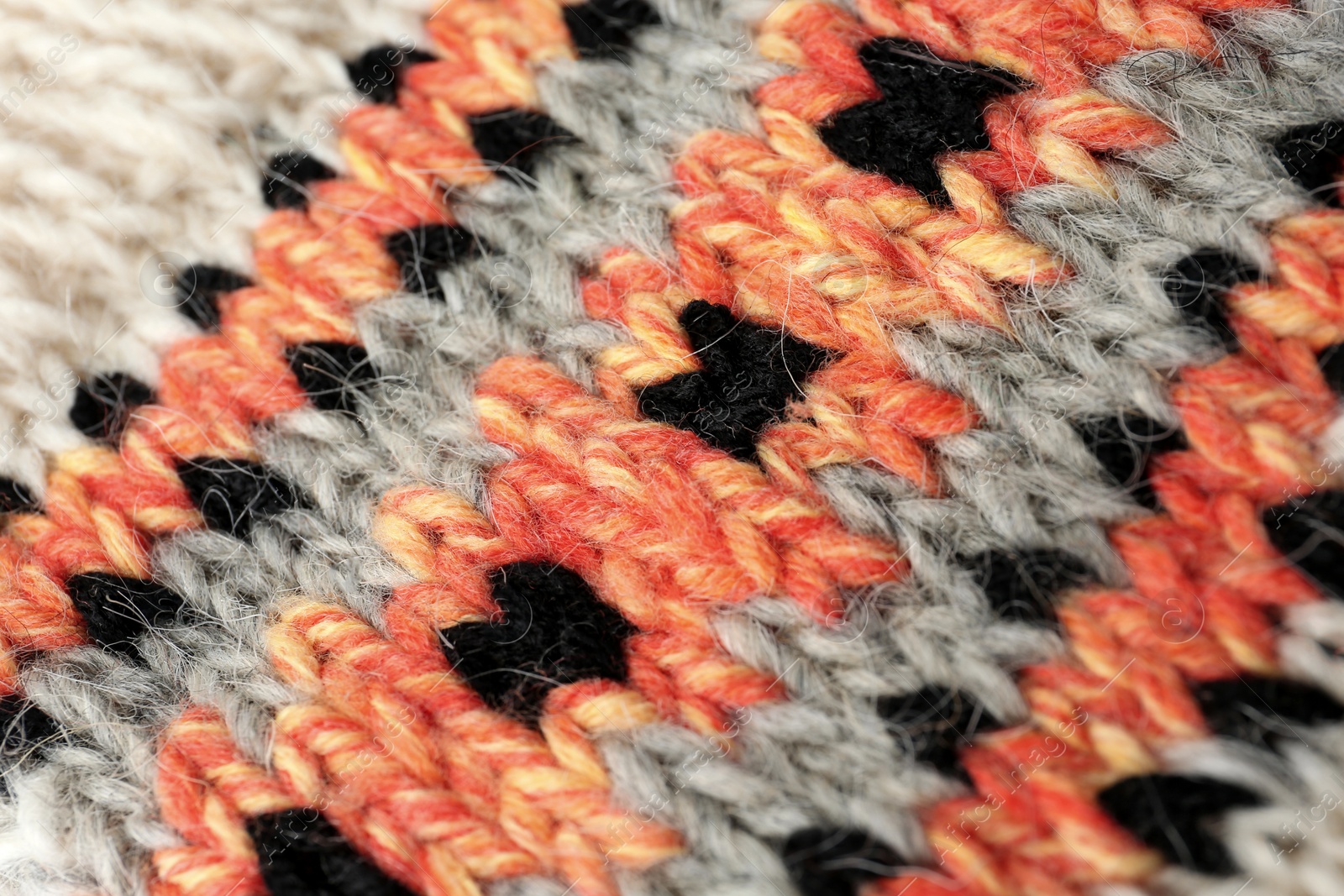 Photo of Knitted soft woolen sock as background, closeup