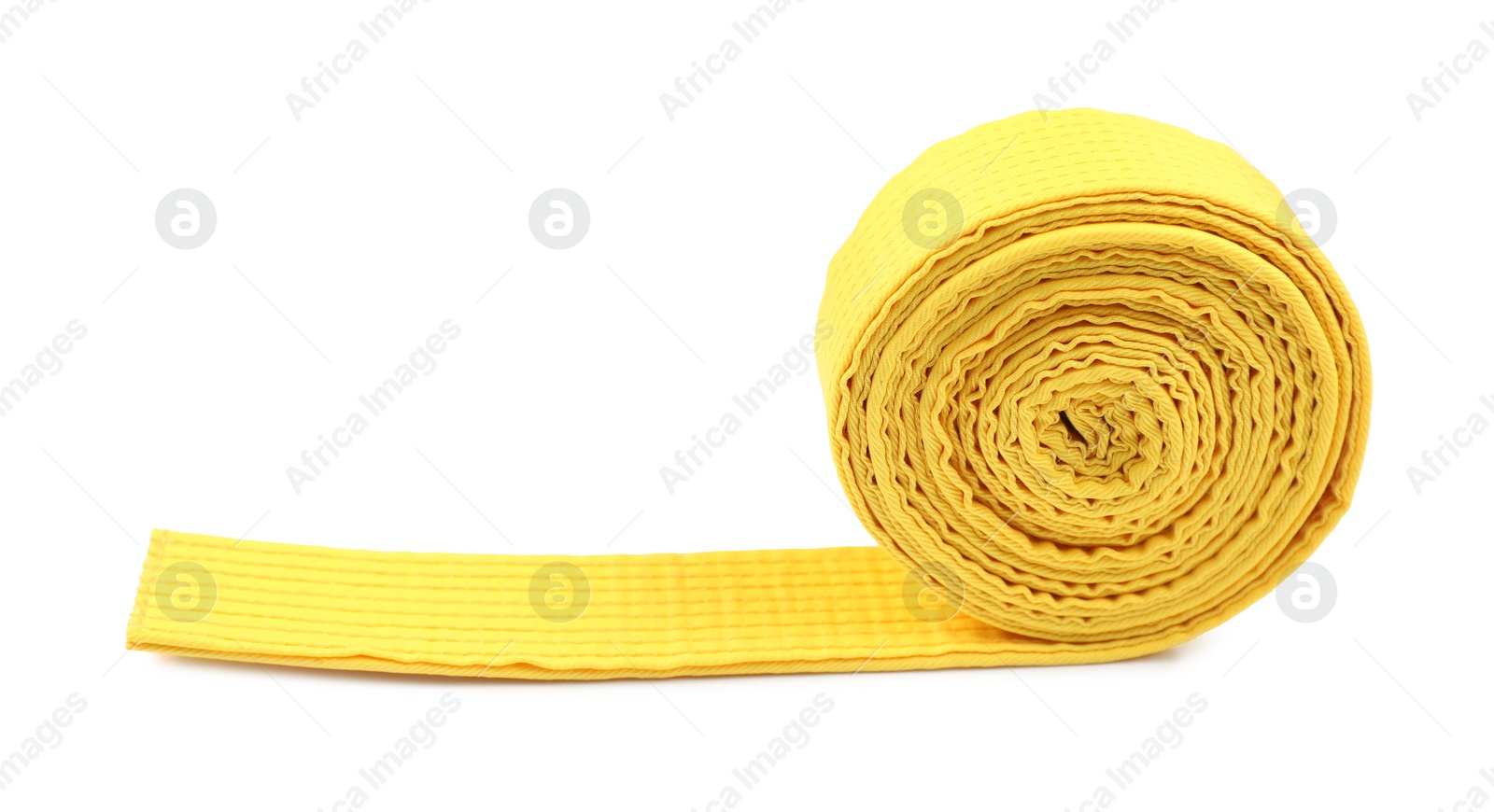 Photo of Yellow karate belt isolated on white. Martial arts uniform
