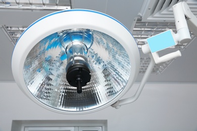 Powerful surgical lamp in modern operating room