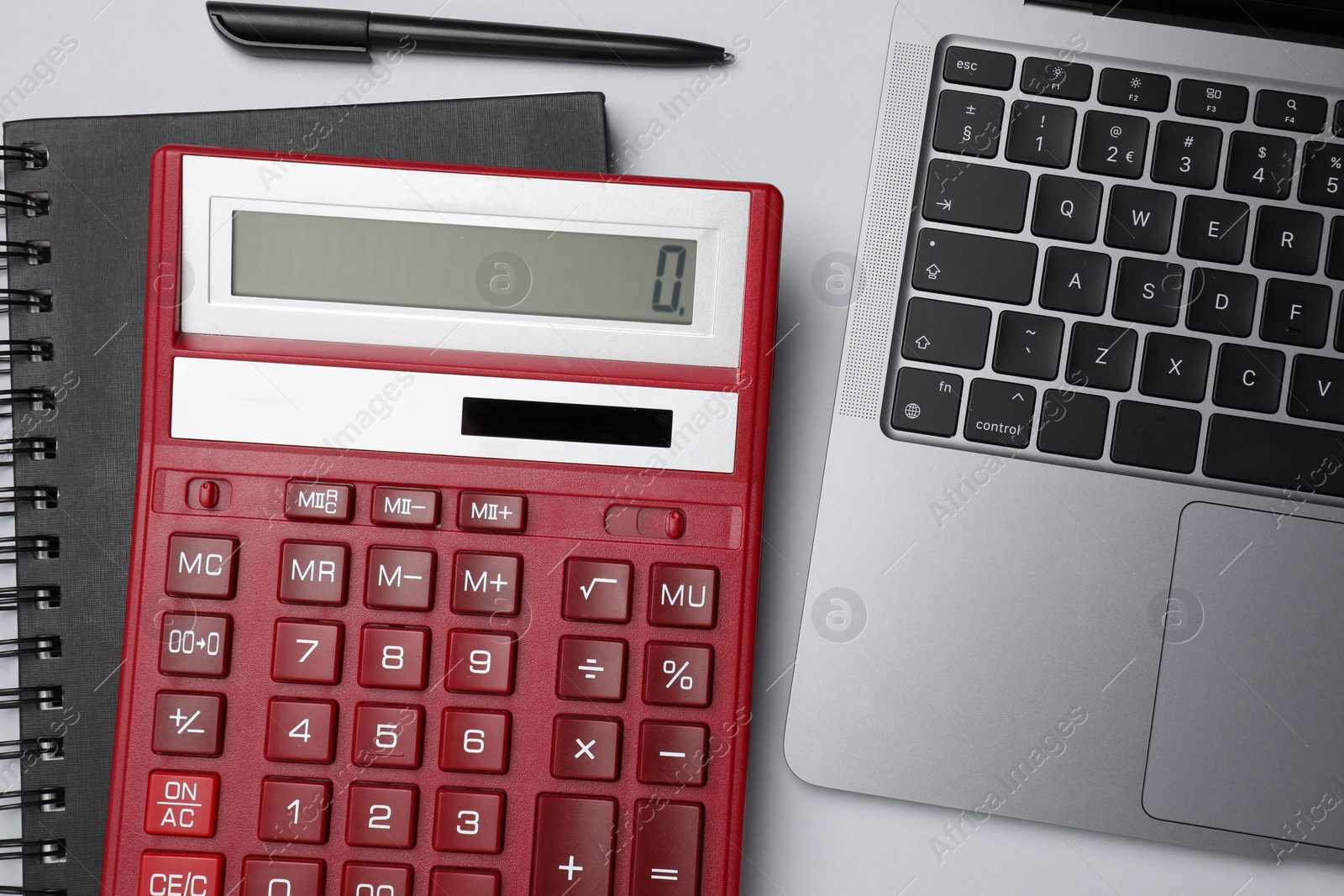 Photo of Calculator, laptop, notebook and pen on white background, flat lay