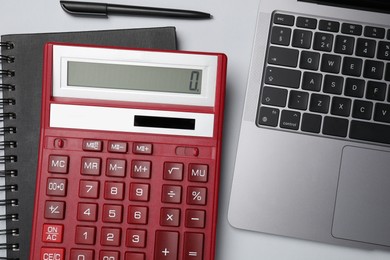 Photo of Calculator, laptop, notebook and pen on white background, flat lay