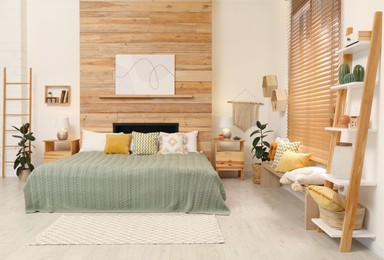 Stylish room interior with big comfortable bed