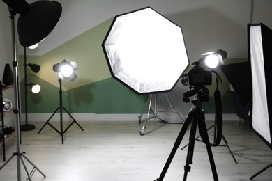 Photo of Interior of modern photo studio with professional equipment