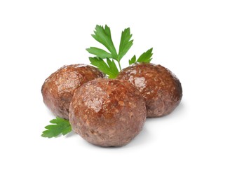 Tasty cooked meatballs with parsley on white background