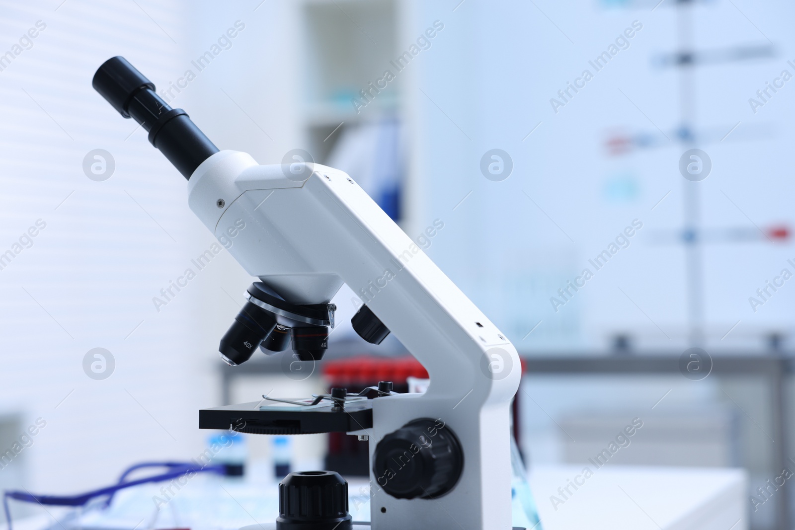 Photo of Modern medical microscope in laboratory, closeup. Space for text