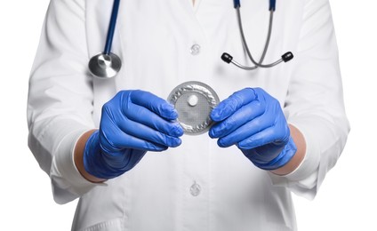 Photo of Doctor holding blister of emergency contraception pill on white background, closeup