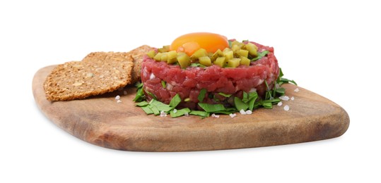 Photo of Tasty beef steak tartare served with yolk, pickled cucumber and sliced bread isolated on white