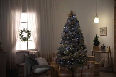 Beautiful interior of living room with decorated Christmas tree
