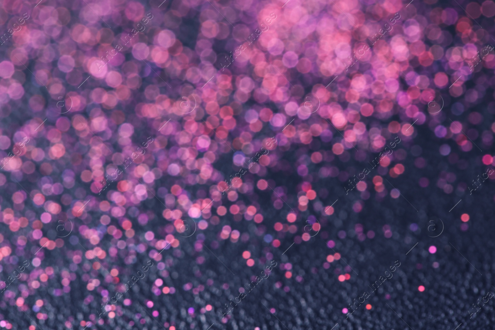 Photo of Magic pink bokeh effect on dark background