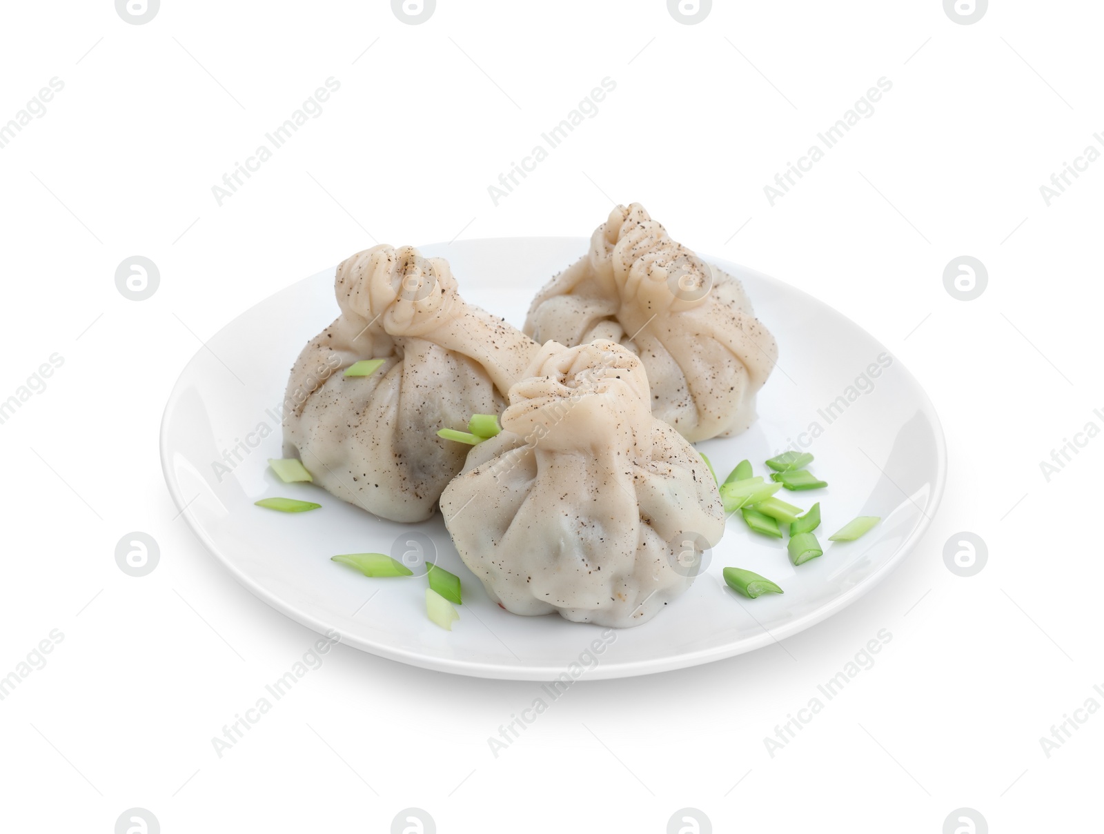 Photo of Plate with three tasty khinkali (dumplings) and onion isolated on white. Georgian cuisine