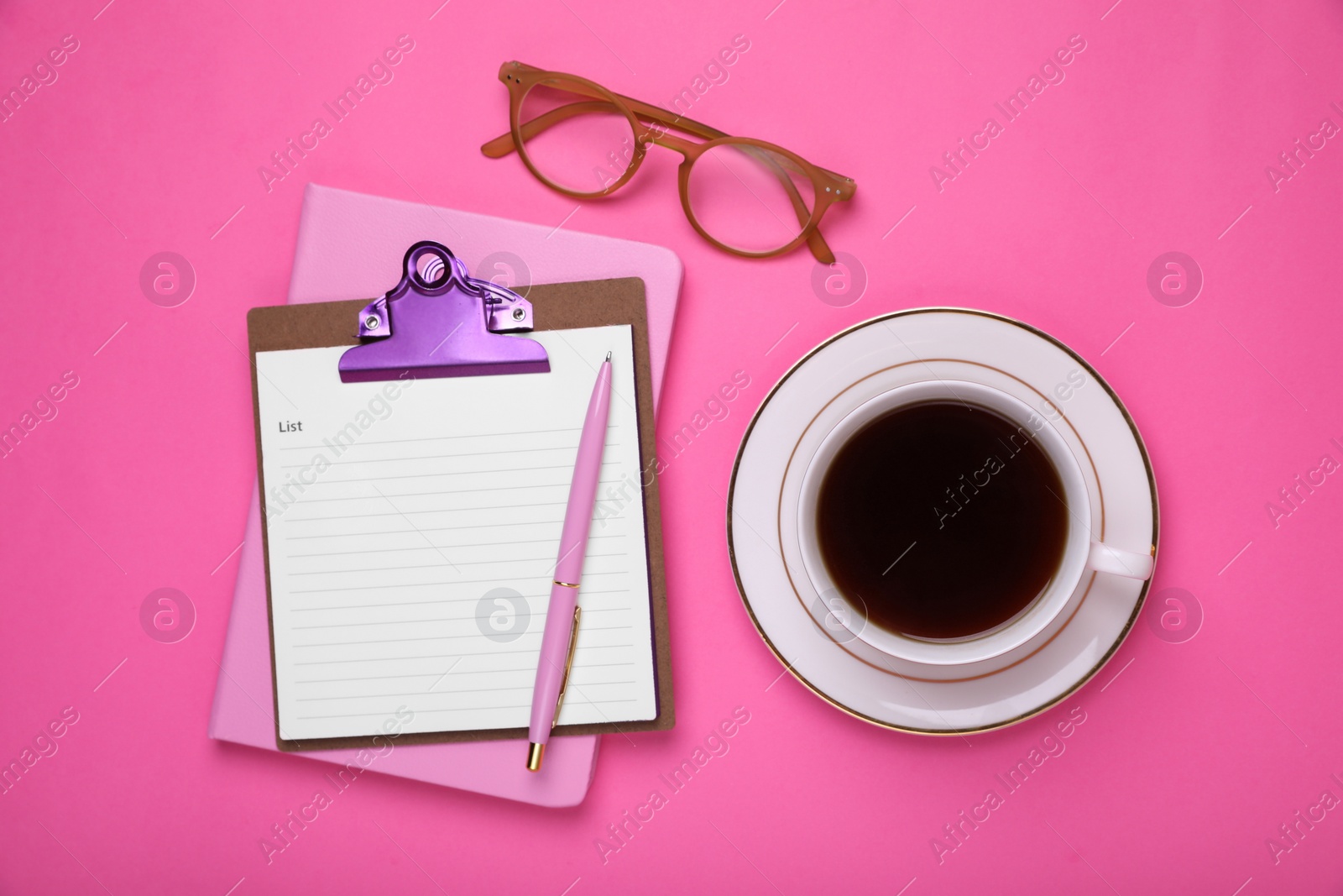 Photo of Clipboard with to do notes, planner, cup of coffee and glasses on pink background, flat lay. Space for text