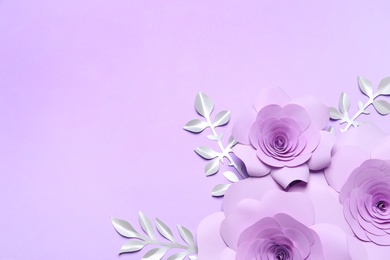 Photo of Beautiful flowers and branches made of paper on violet background, flat lay. Space for text