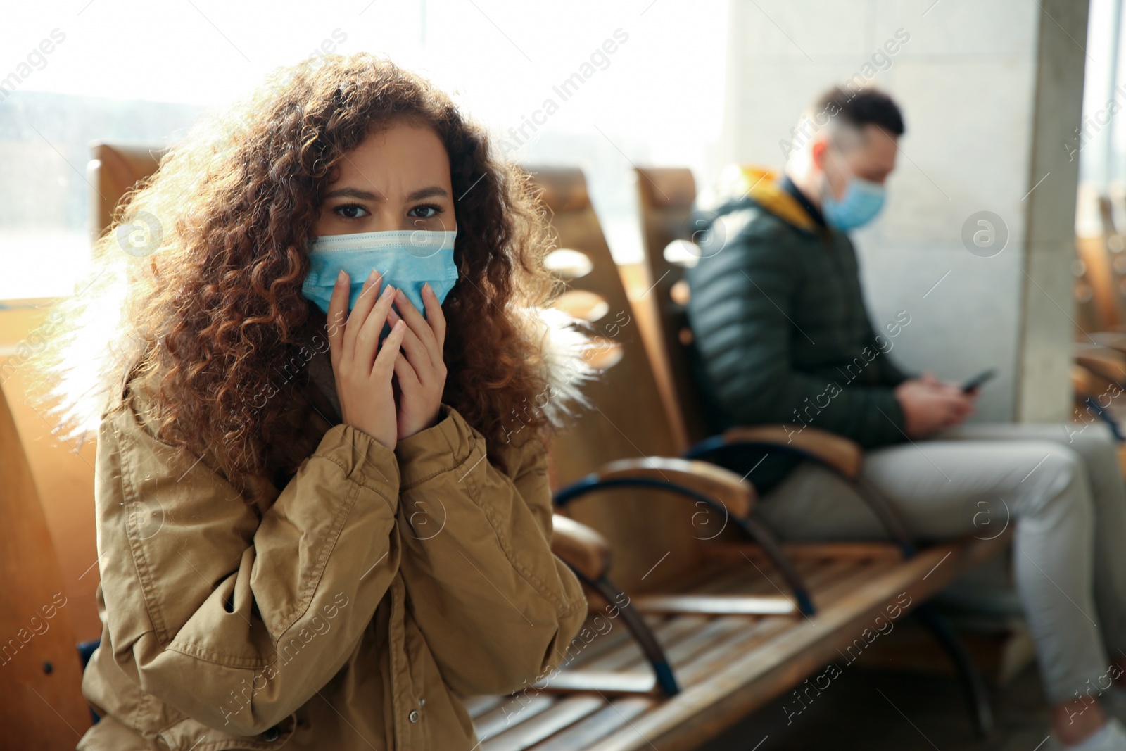 Photo of African-American woman with disposable mask indoors. Virus protection