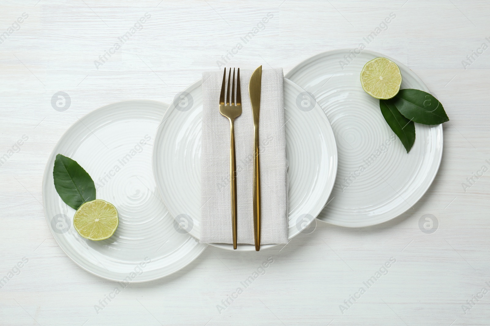 Photo of Composition with stylish ceramic plates on white wooden table, top view