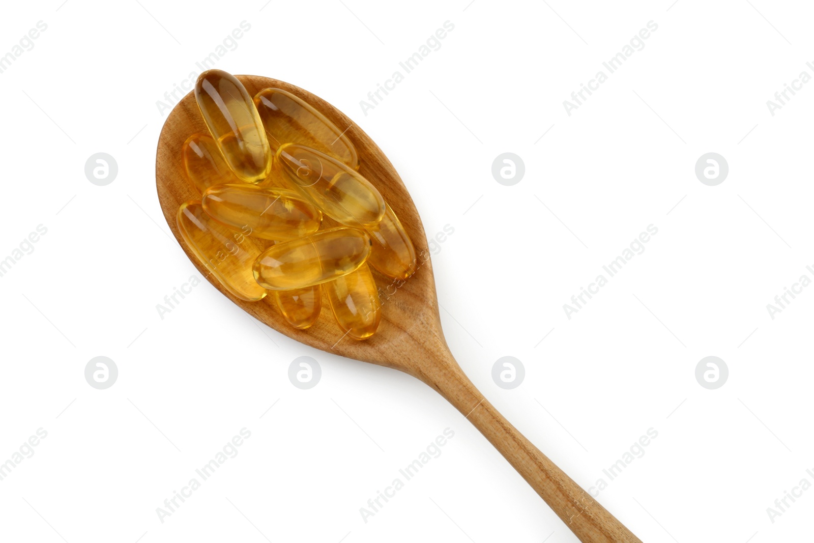 Photo of Vitamin capsules in wooden spoon isolated on white, top view. Health supplement