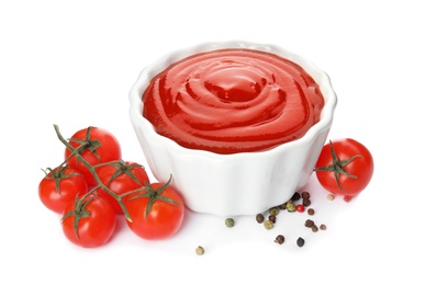 Tasty homemade tomato sauce in bowl and ingredients on white background