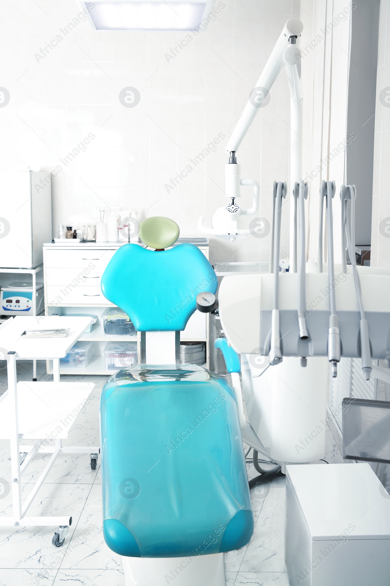 Photo of Dentist's office with modern chair and professional equipment