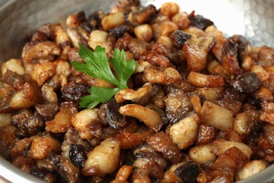 Photo of Tasty cooked cracklings in frying pan, closeup. Pork lard