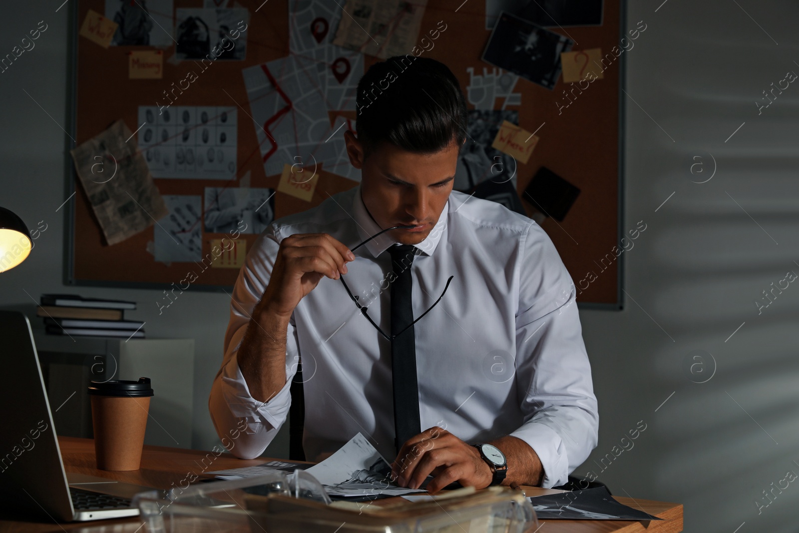 Photo of Detective working at desk in his office