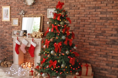 Photo of Blurred view of room with beautiful Christmas tree