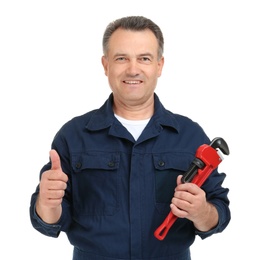 Mature plumber with pipe wrench on white background