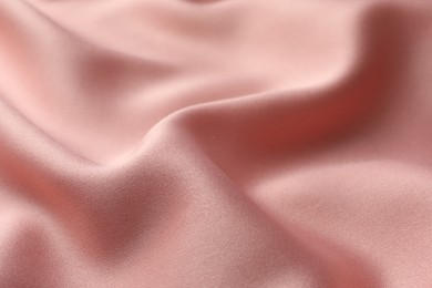 Photo of Texture of pink silk fabric as background, closeup