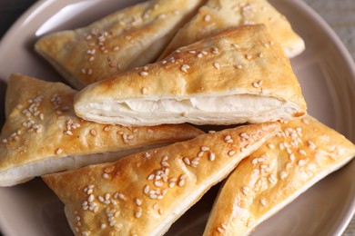 Delicious fresh puff pastries on table, closeup