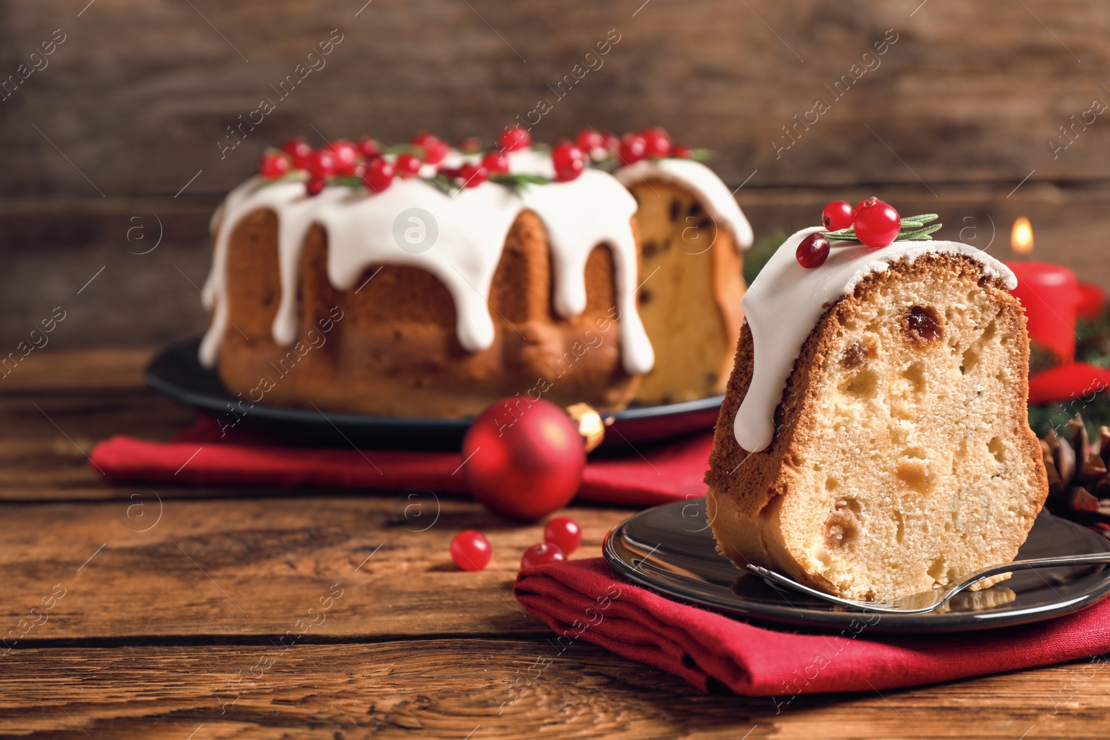 Photo of Composition with piece of traditional homemade Christmas cake on wooden table, closeup. Space for text