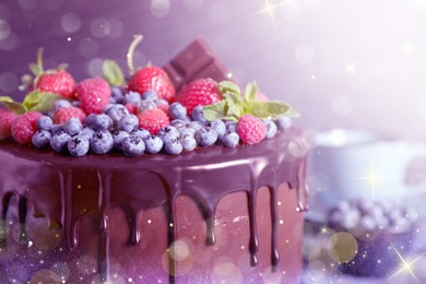 Freshly made tasty chocolate cake decorated with berries on table, closeup. Tasty dessert for Christmas dinner