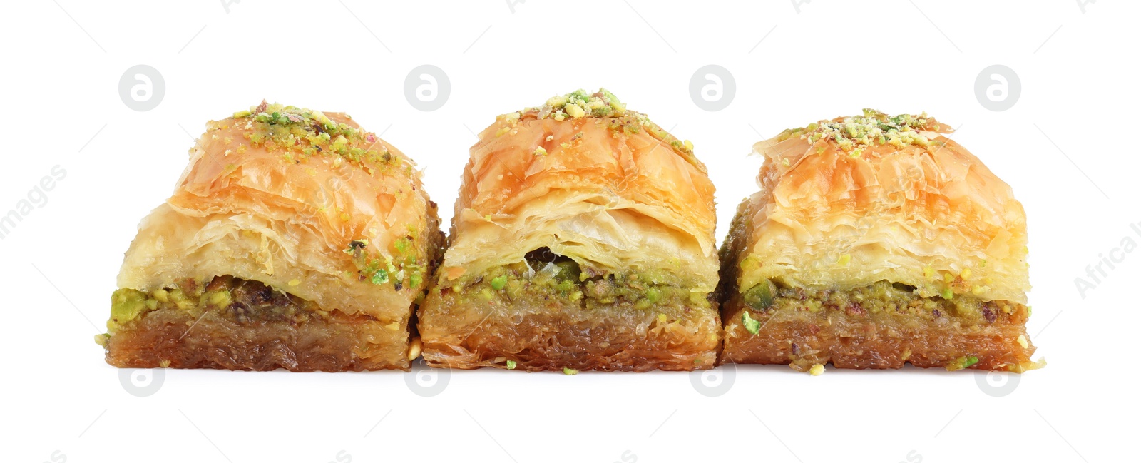 Photo of Delicious fresh baklava with chopped nuts isolated on white. Eastern sweets