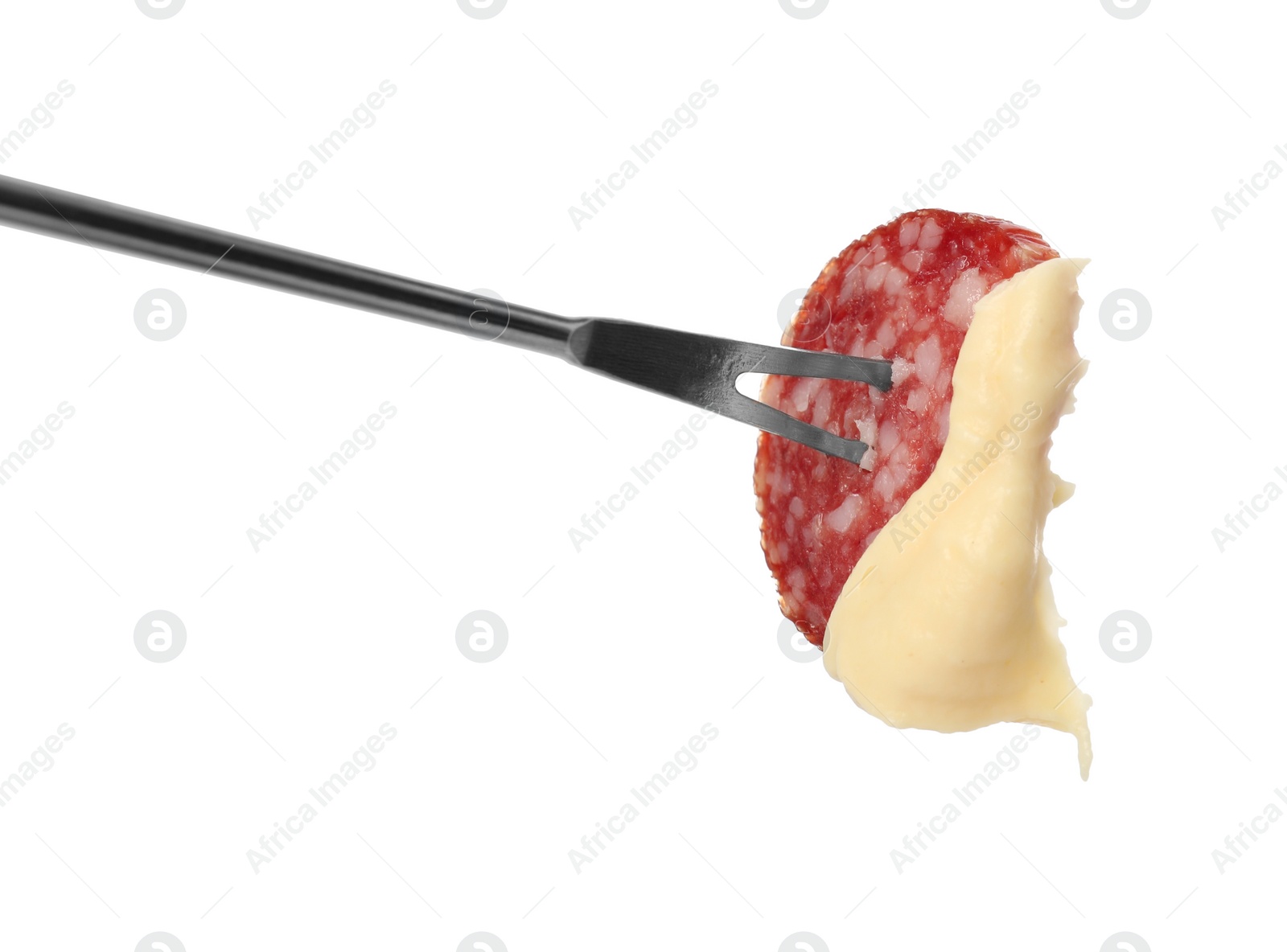 Photo of Tasty fondue. Fork with salami and melted cheese isolated on white