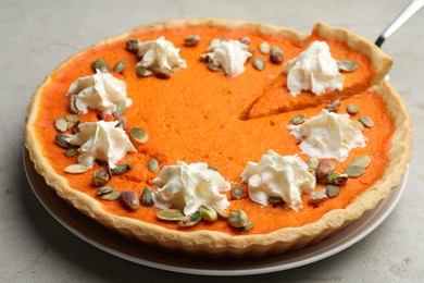 Photo of Delicious homemade pumpkin pie on light table