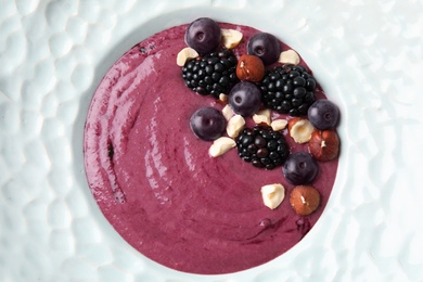 Photo of Plate of tasty acai smoothie, close up view