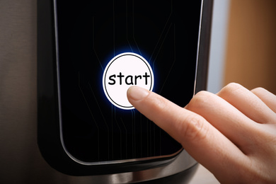 Woman pointing at start icon on screen, closeup