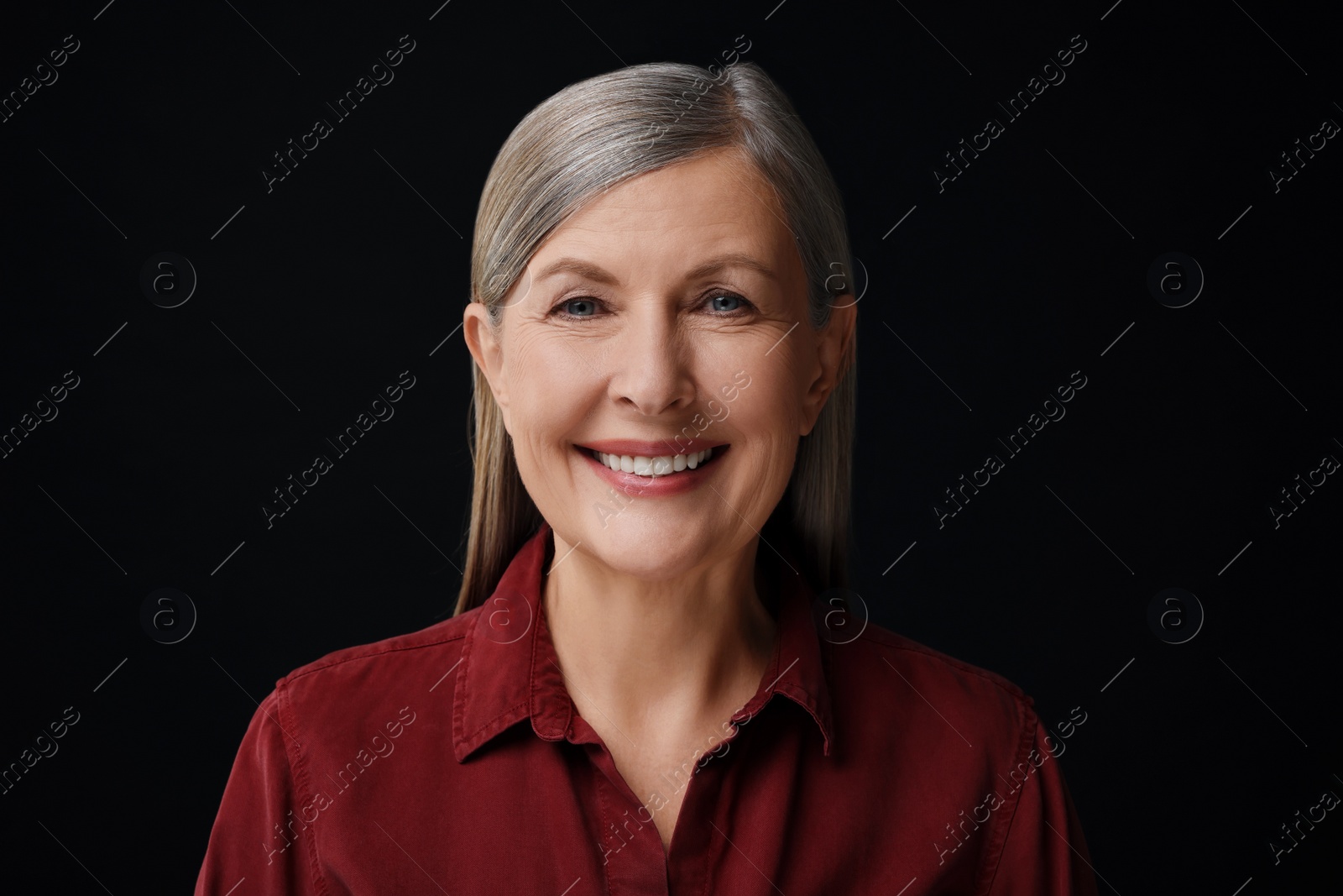 Photo of Personality concept. Portrait of happy woman on black background