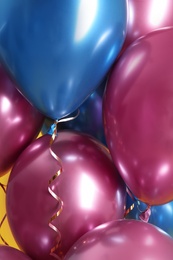 Photo of Bunch of bright balloons, closeup view. Party objects