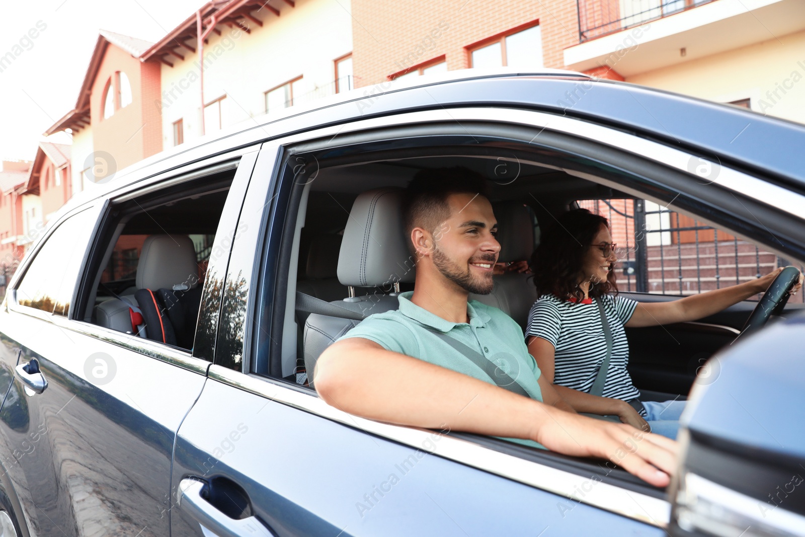 Photo of Happy family traveling by car on summer day