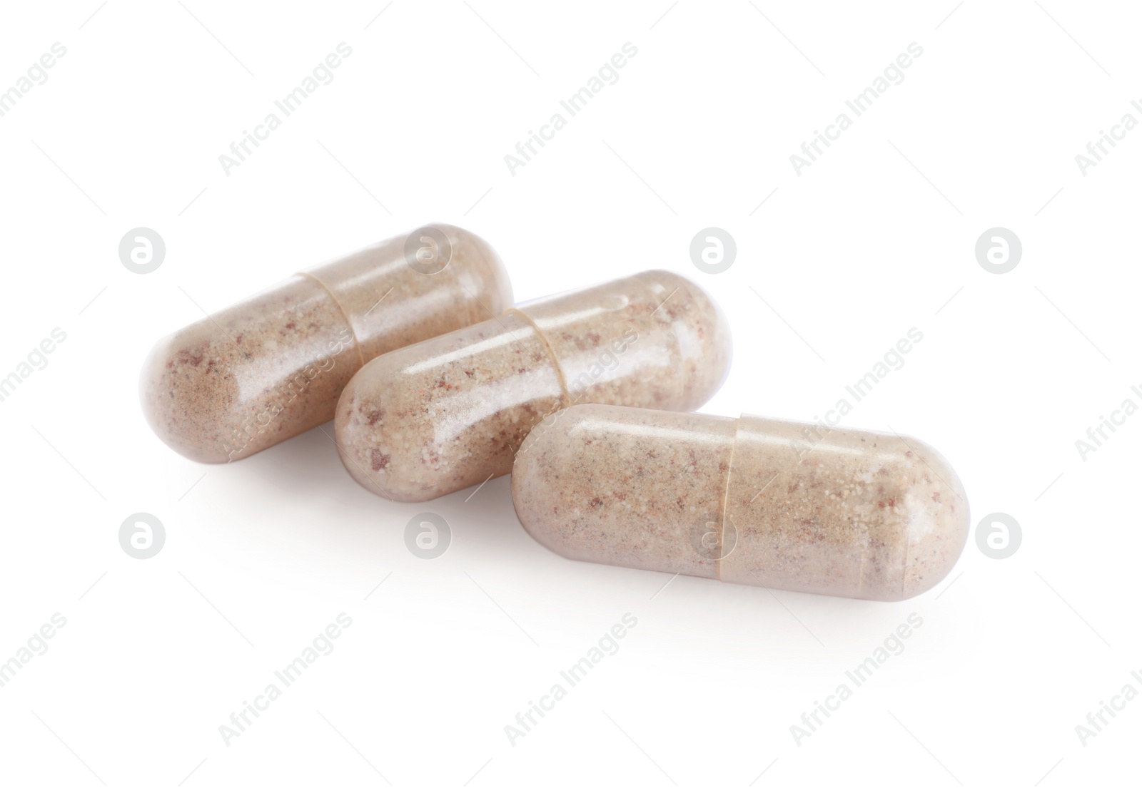 Photo of Many transparent gelatin capsules on white background