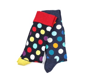 Photo of Colorful socks on white background, top view