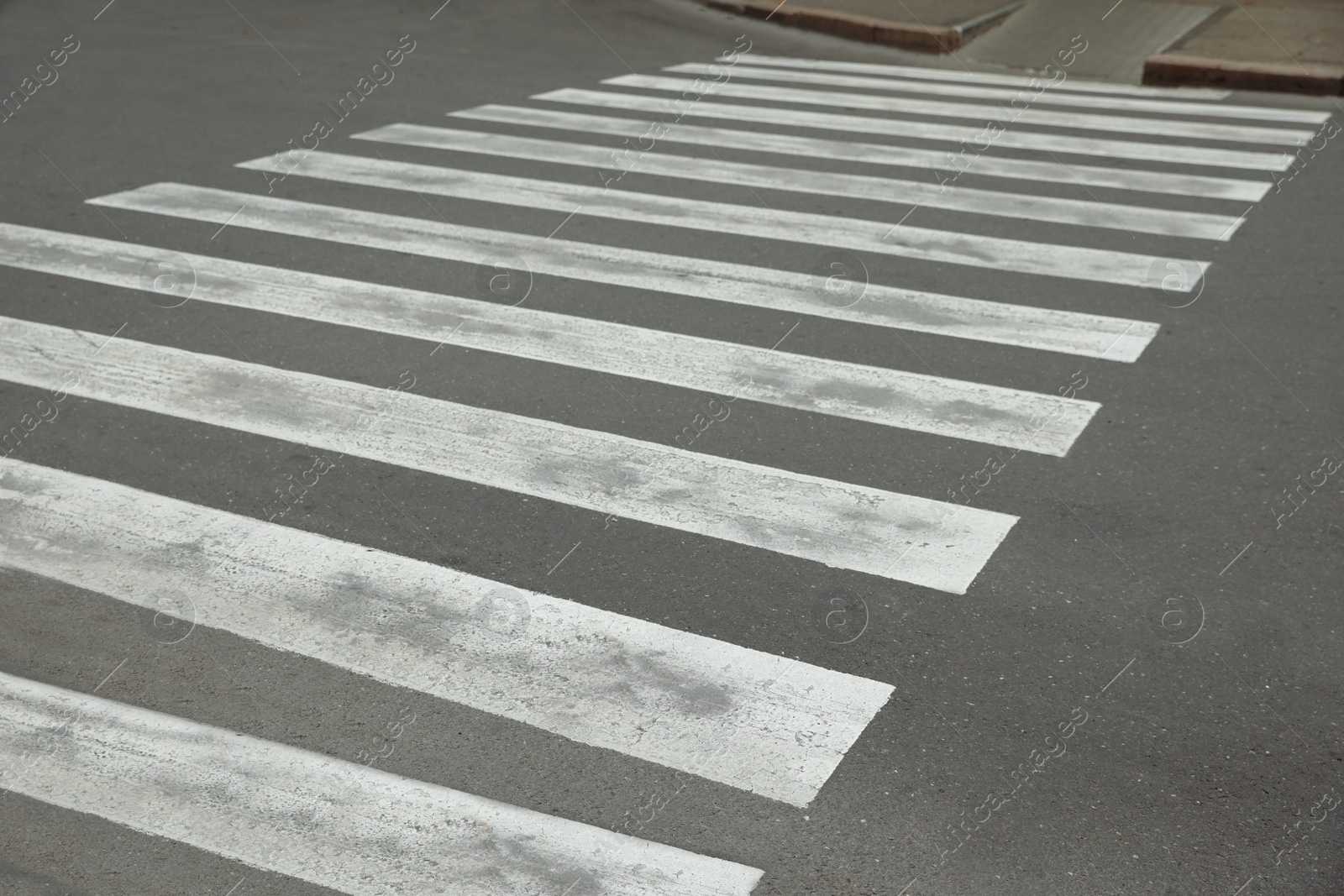 Photo of Pedestrian crossing on empty city street in autumn