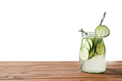 Natural lemonade with cucumber in jar on wooden table