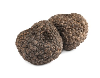 Fresh whole black truffles isolated on white