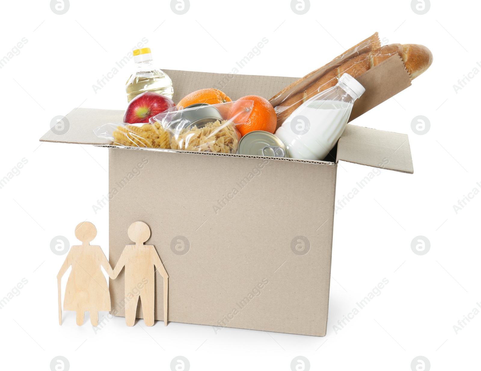 Photo of Humanitarian aid for elderly people. Cardboard box with donation food and wooden figures of couple isolated on white