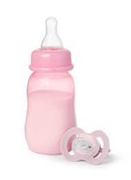 Photo of Feeding bottle with milk and pacifier on white background