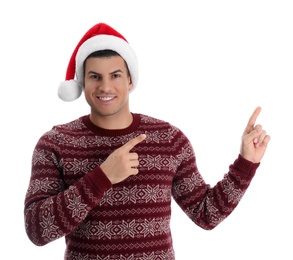 Handsome man wearing Santa hat on white background