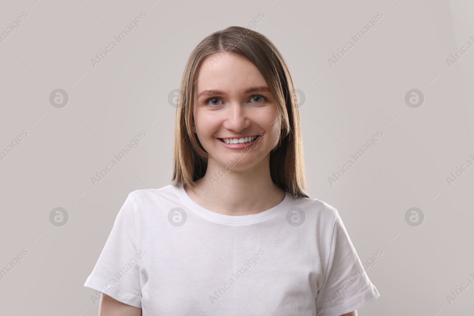 Photo of Portrait of beautiful woman on gray background